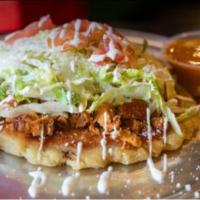 Huarache Meal · A thick handmade tortilla stuffed with black beans, smoother with a tomato-cilantro sauce, y...