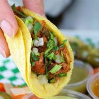 Street Taco a la Carte · Two soft corn tortilla with your choice of meat topped with onions and cilantro. VERY AUTHEN...