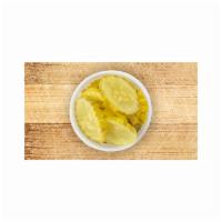 Side Pickles · Sliced crunchy dill pickles in a 4oz container.