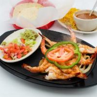 Fajita de Camarones · Fresh jumbo shrimp seasoned and broiled Mexicali-style. Served with three flour tortillas, M...