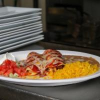 Chicken Enchilada · Topped with our guajillo pepper sauce.