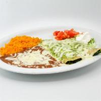 Spinach Enchiladas · Two corn tortillas stuffed with cheese and spinach. Topped with our homemade spinach cream s...