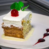 Tres Leches Cake · A sponge cake , saturated in a mix of three milks, with homemade whippped cream spread over ...