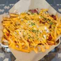 Pastrami Fries · French fries topped with house made hot sauce, pepper corned beef pastrami, melted mixed che...