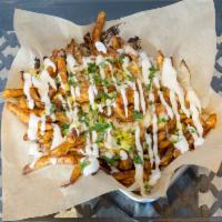 Jerk Shrimp Fries · French fries topped with jerk spiced shrimp, mango pico, melted pepper jack cheese and house...