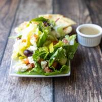 Greek Salad · Tender crisp lettuce topped with Feta cheese, Kalamata olives, tomatoes, cucumbers, onions a...