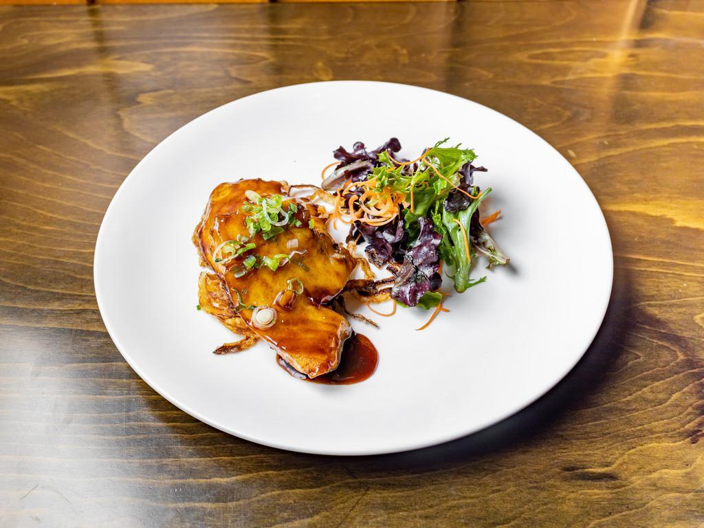 Miso Glazed Chilean Sea Bass · Served with salad and rice.