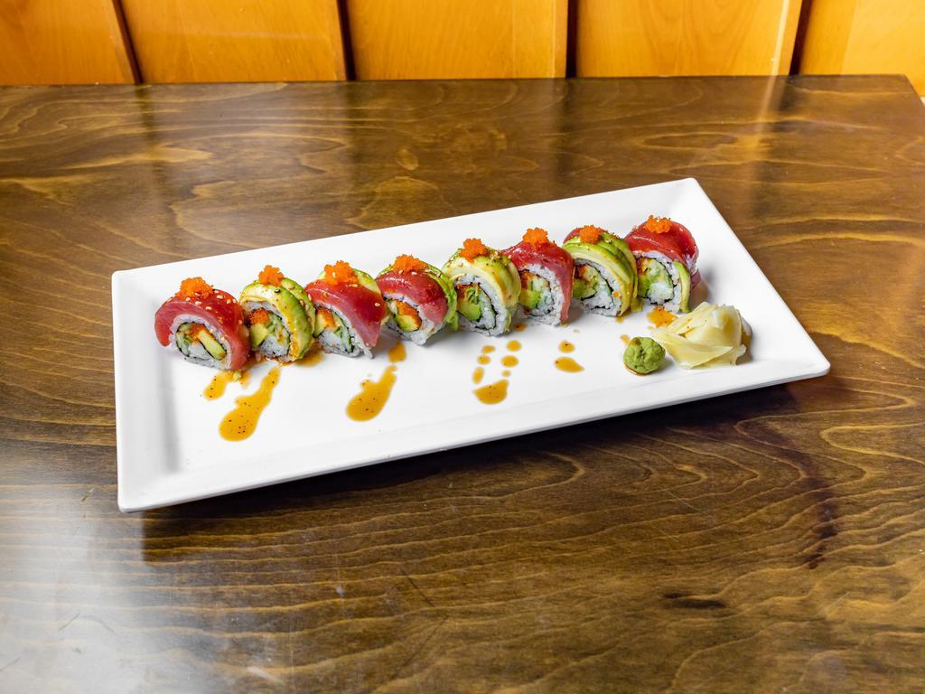 Tuna Broken Heart Roll · Caviar, avocado, and kappa inside with tuna. Avocado and caviar wrapped outside. Topped with spicy sauce, scallion, and sesame seeds.