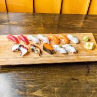 Sushi Deluxe Dinner · 2 tuna, 2 yellowtail, tako, 2 saba, 2 salmon, eel, tobiko, and white fish. Served with salad.