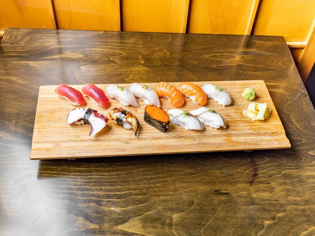 Sushi Deluxe Dinner · 2 tuna, 2 yellowtail, tako, 2 saba, 2 salmon, eel, tobiko, and white fish. Served with salad.