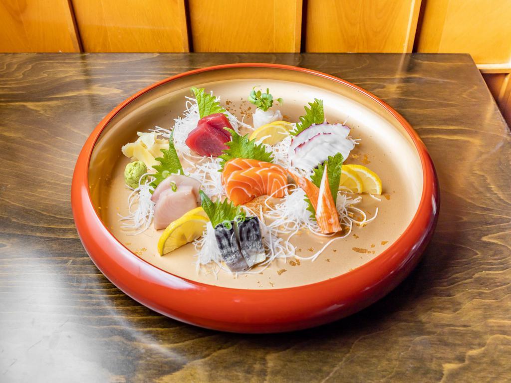 Samurai Sashimi · 2 tuna, 2 yellowtail, 2 tako, 2 saba, 2 salmon, kani, and three white fish. Served with salad and rice.