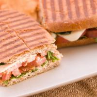 Italiano Sandwich · Imported spicy capitol, smoked ham, sharp provolone, roasted red peppers and basil pesto spr...