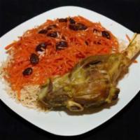 Lamb Shank · Spacil Afghan dish. A big chank of tender lamb under the rice with carrot and risan served w...