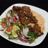 Lamb Kabob · Large pieces of tender lamb, marinated in special spices and garlic skewered and broiled ove...
