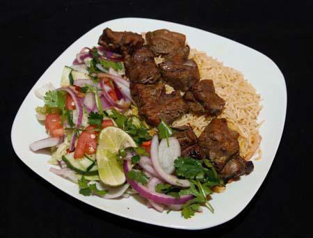 Lamb Kabob · Large pieces of tender lamb, marinated in special spices and garlic skewered and broiled over charcoal. 