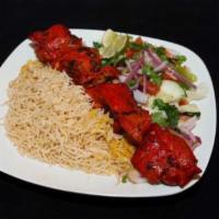 Bone in Chicken Kabob · Juicy chicken still on the bone, marinated in a special blend of herbs and spices, broiled o...