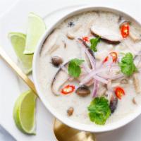S2. Tom Kha  · An aromatic and mildly spiced soup that includes cabbage, mushrooms, red onion, tomatoes and...