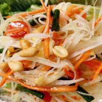 Y1. Papaya Salad · Shredded green papaya, garlic, tomatoes and string beans tossed in a special lime dressing a...