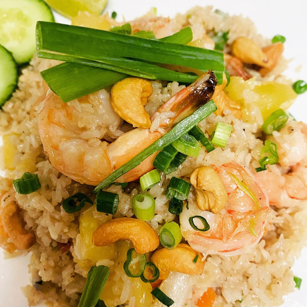 R3. Pineapple Fried Rice · Shrimp and chicken cooked with pineapple, onions, peas, carrots, cashews and egg. Malaysian style optional-adds yellow curry powder and bean sprouts.