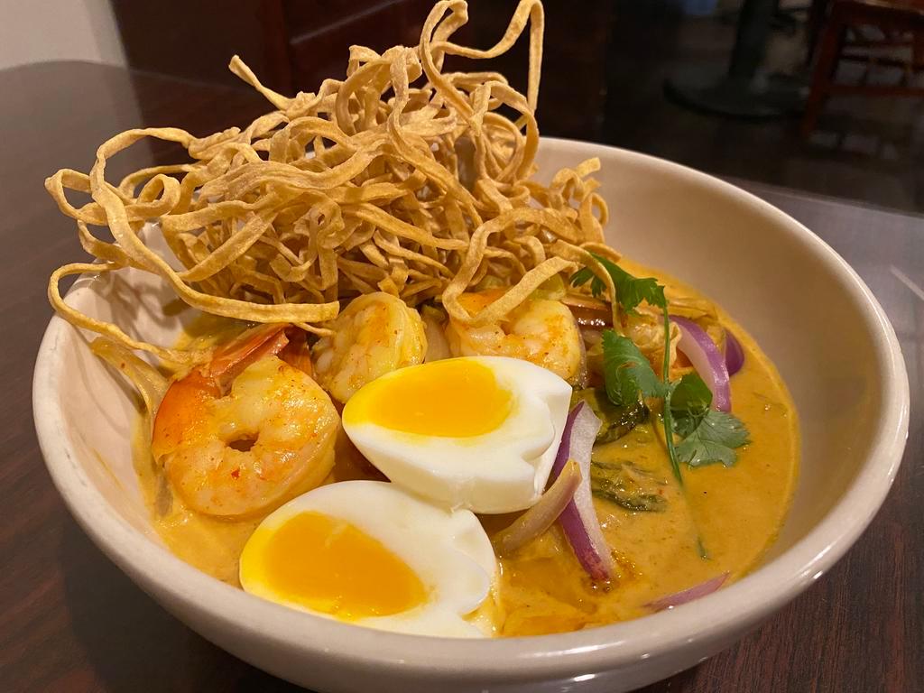 N5 Khao Soi · Northern Thai Coconut Curry Noodle Soup with egg noodles, onions, house pickled mustard green topped with crispy egg noodles