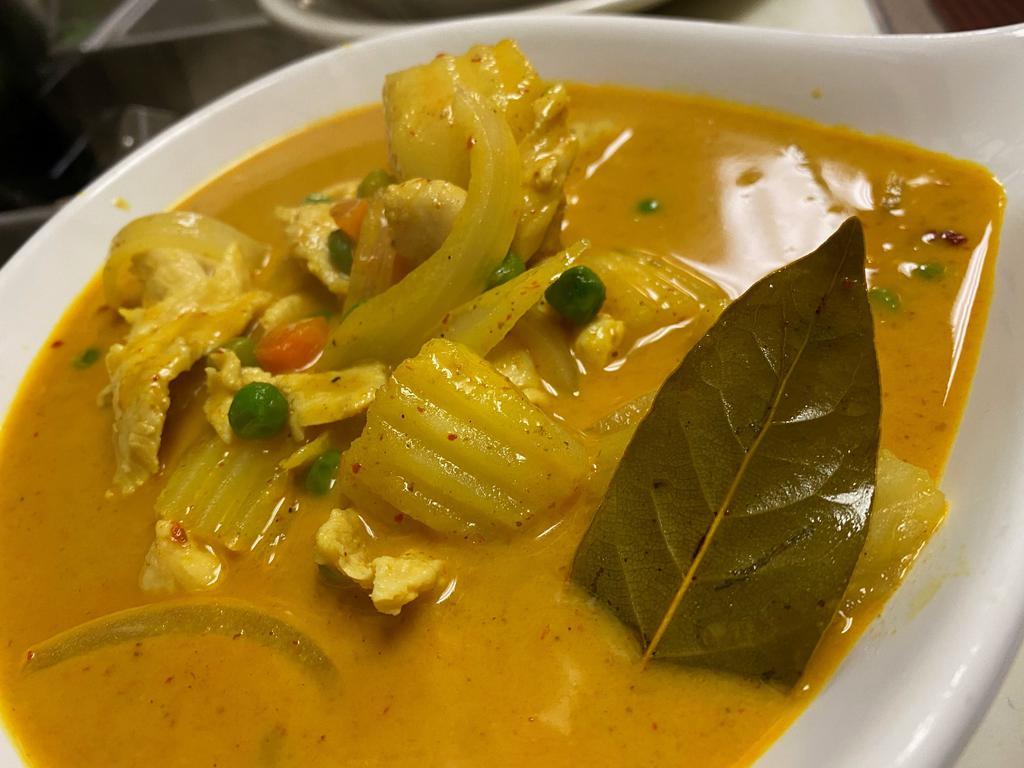 C3. Yellow Curry · Yellow curry paste includes potatoes, onions, peas, carrots in coconut milk.