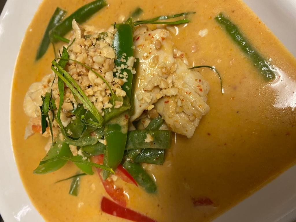 C5. Panang Curry · Panang curry paste in coconut milk includes bell pepper, kaffir lime leaves and topped with ground peanuts.
