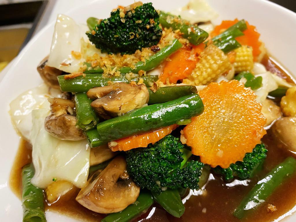AC6. Stir-Fried Mixed Vegetable · Includes onions, cabbage, carrots, broccoli, mushrooms and bean sprouts sauteed in oyster sauce.