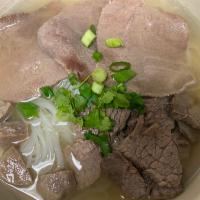 P2. Beef Noodle Soup · Rice noodles with beef, bean sprout, scallion, cilantro, garlic oil in beef broth.