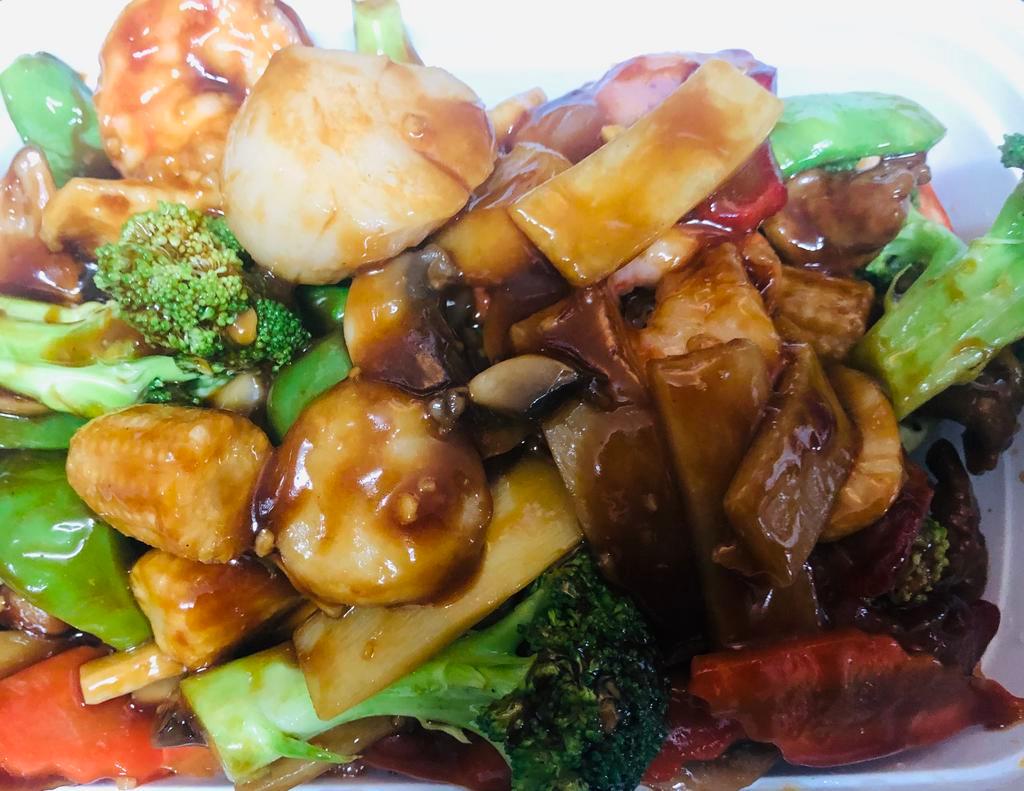 Happy Family · Chicken, beef, shrimp, pork, scallop, crabmeat and vegetables stir-fried in brown sauce. 