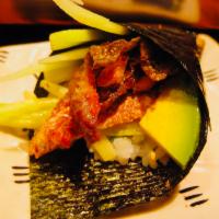 Salmon Skin Roll · Fried salmon skin, avocado and cucumber. Ell sauce on top.