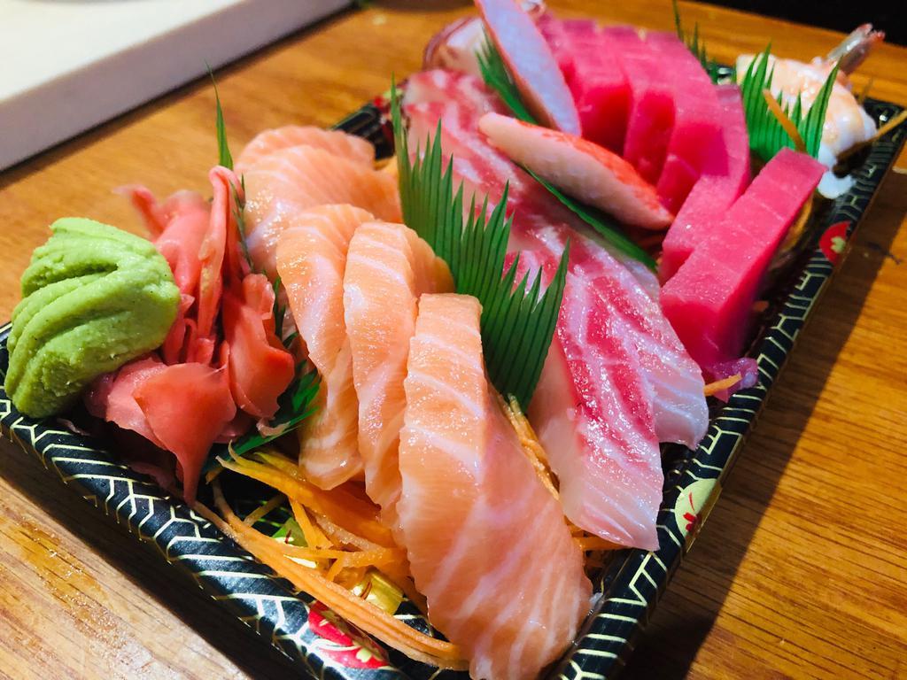 Sashimi Deluxe · Assorted 20 pieces of assorted sashimi and rice. 