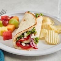 Greek Salad Gyro · Tomatoes, cucumbers, roasted red peppers, red onions, mixed lettuce, feta, and Greek dressin...