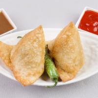 2 Veggie Samosa · Crispy fried pastry sheet stuffed with a mixture made from fresh potatoes, green peas, and g...