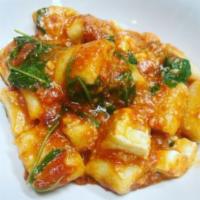 Ricotta Gnocchi · Crushed Tomato, Basil, Parmigiano, Arugula, Mozzarella