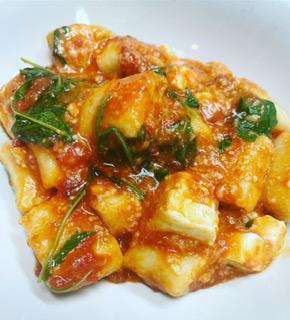 Ricotta Gnocchi · Crushed Tomato, Basil, Parmigiano, Arugula, Mozzarella