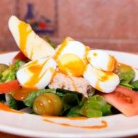 Tuna Salad · Romaine lettuce, tomatoes, Kalamata olives, hard-boiled egg, and Genova yellowfin tuna in ol...
