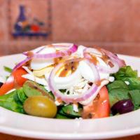 Spinach Salad · Organic baby spinach, grated fresh mozzarella, tomatoes, olives, red onions, and hard boiled...