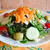 Mixed Greens Salad · Organic mixed baby greens, carrots, grated fresh mozzarella, olives, and cherry tomatoes.