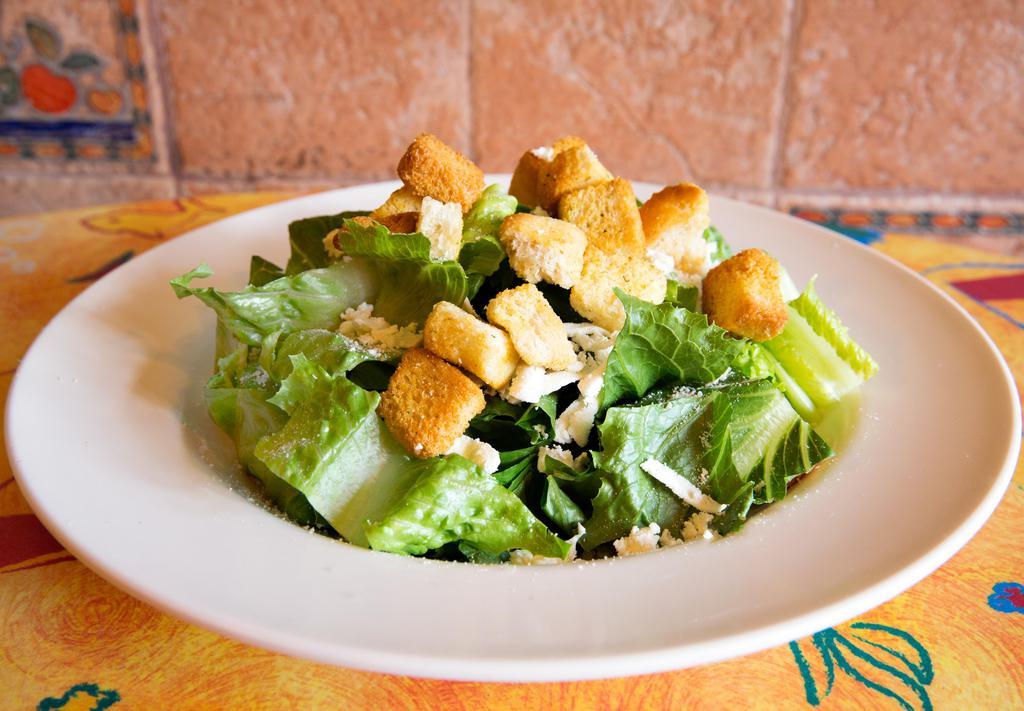 Caesar Salad · Romaine lettuce, seasoned croutons, grated fresh mozzarella, and Parmesan cheese.