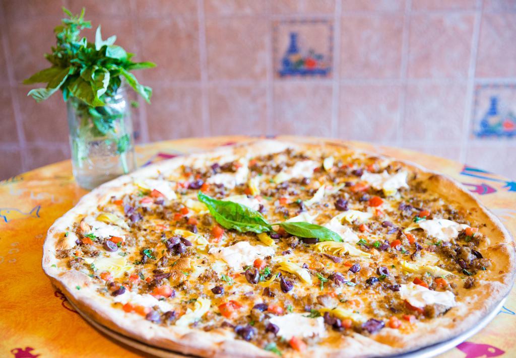 Focaccia Pizza · Tomatoes, sausage, artichoke hearts, Kalamata olives, herbs and organic fresh mozzarella.
