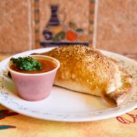 Cheese Calzones · Made to order, bursting with mozzarella, ricotta, and Parmesan cheese! Add toppings for an a...