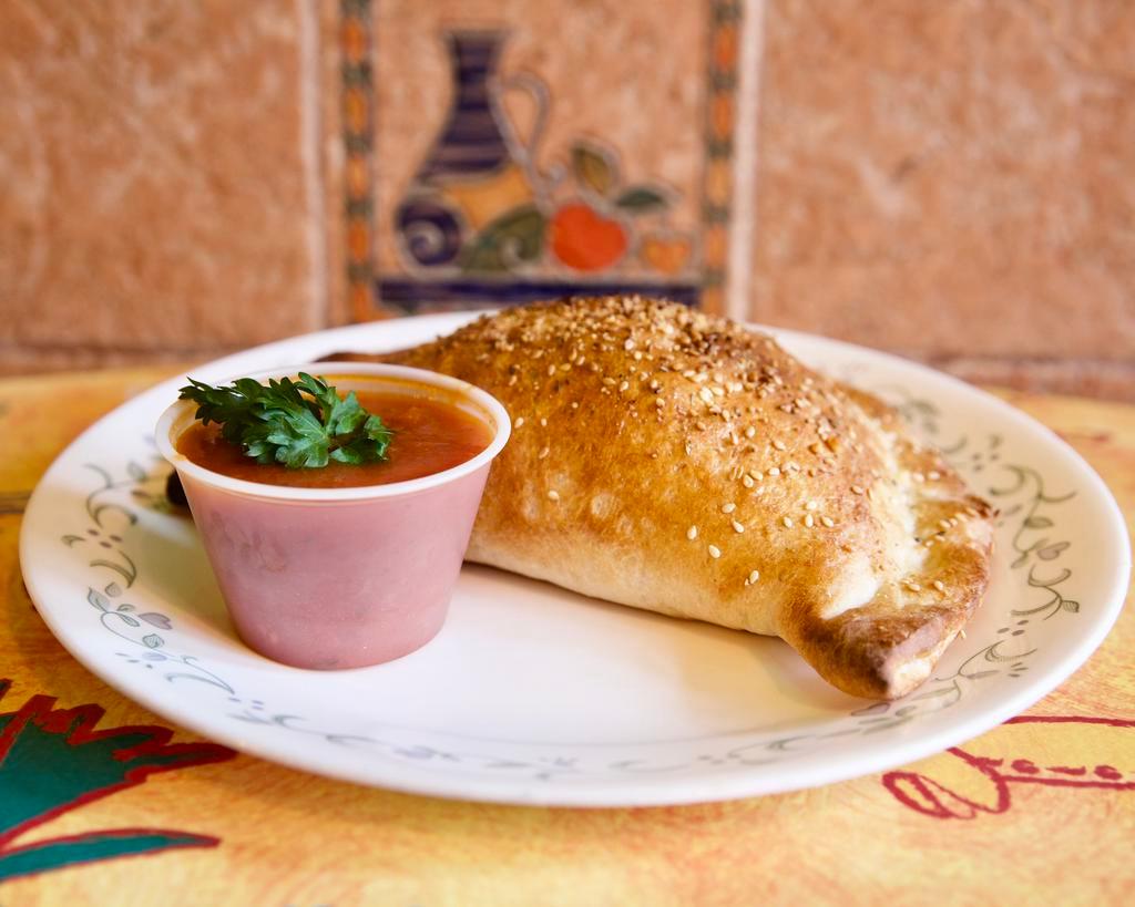 Cheese Calzones · Made to order, bursting with mozzarella, ricotta, and Parmesan cheese! Add toppings for an additional charge.
