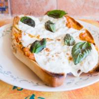 Bruschetta · Grilled hero topped with tomatoes, fresh basil, garlic, olive oil, and fresh mozzarella chee...