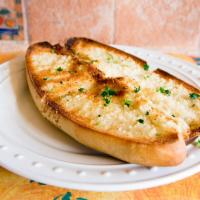 Garlic Bread · The perfect side for any pasta, our buttery garlic bread is baked in the oven with garlic, h...