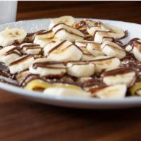 Creamy Nutella Crepes(3) · Nutella inside and on top with the option to add fresh fruit.