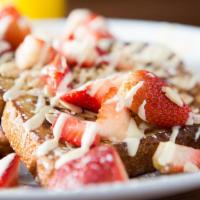 Strawberry Almond French Toast · Fresh strawberries, sliced almonds and vanilla anglaise.