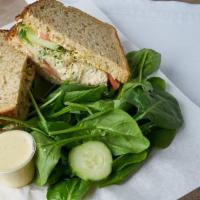 tuna salad sandwich · Wild albacore tuna salad, sprouts, tomato, mayonnaise and mustard on whole wheat bread 