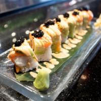 34 Tiger Roll · Crunchy spicy salmon, cucumber, outside with salmon, avocado, tobiko and service with lemon ...