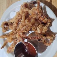 Fried Calamari · Squid hand dusted with seasoned coating and fried.