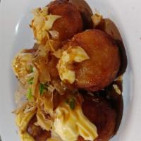 Takoyaki · Deep-fried crispy balls stuffed with vegetables and octopus.
